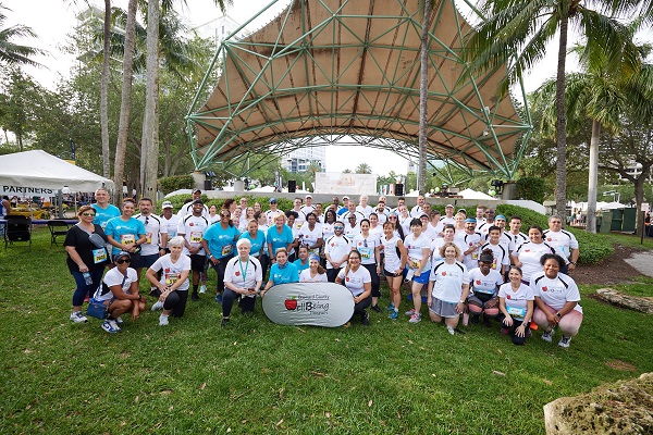 Visit Lauderdale Team and other Broward County Employees gathered in front of the stage at Huizenga Park before running the 2022 Mercedes-Benz Corporate Run 