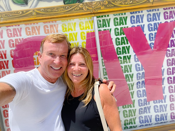 Richard Gray and Stacy Ritter at Stonewall Pride Festival standing in front of a sign that says 